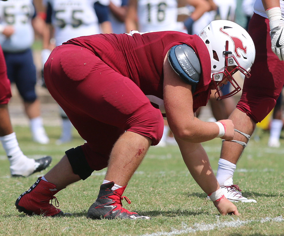 Image: A product of Italy High School and a two-time all state defensive end for the Gladiators, Austin College junior nose guard #50 Zain Byers takes a beating but keeps on hitting for the Kangaroos.