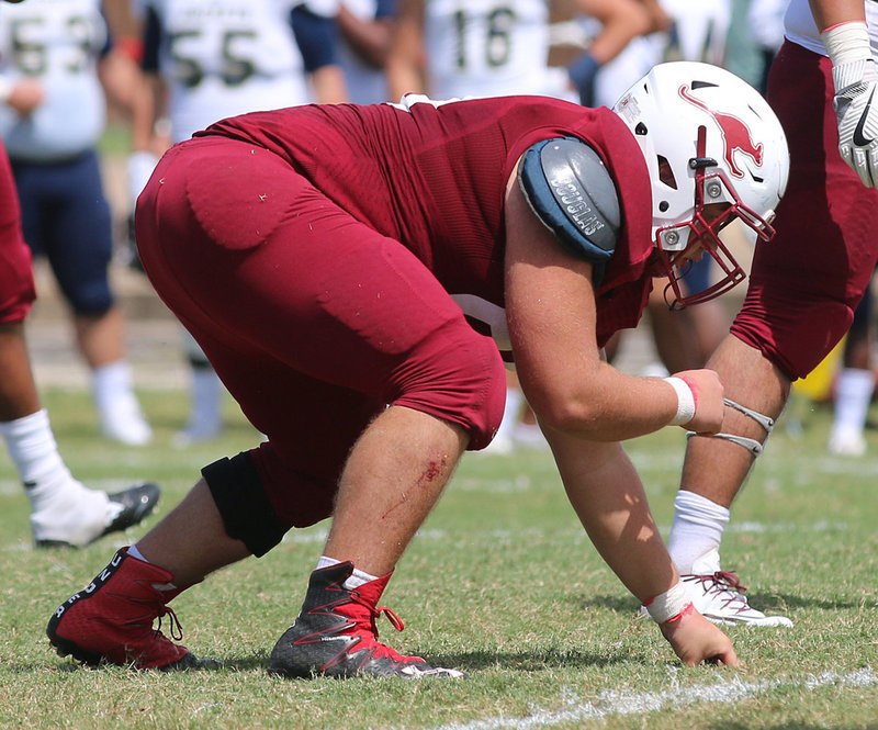 Image: A product of Italy High School and a two-time all state defensive end for the Gladiators, Austin College junior nose guard #50 Zain Byers takes a beating but keeps on hitting for the Kangaroos.