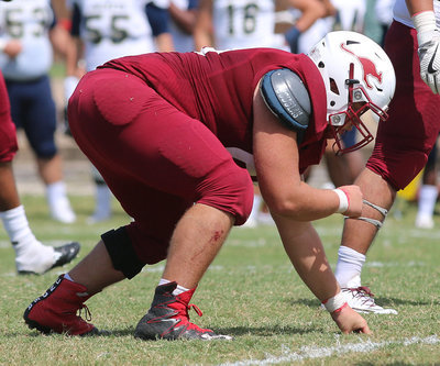 Image: A product of Italy High School and a two-time all state defensive end for the Gladiators, Austin College junior nose guard #50 Zain Byers takes a beating but keeps on hitting for the Kangaroos.
