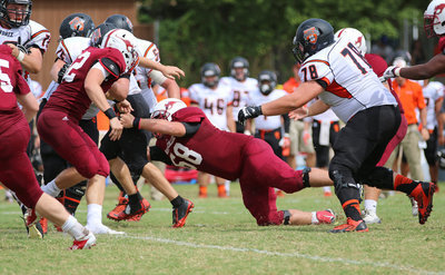 Image: Sophomore Season: Austin College Kangaroo #68 Zain Byers records a tackle against Hendrix during his sophomore season at Austin College.