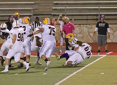 Image: Freshman Season: Austin College freshman #68 Zain Byers tackles a Harden Simmons running back for a loss during a JV scrimmage back in 2014.
