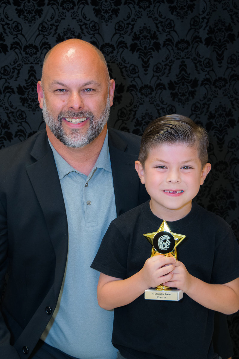 Image: Lee Joffre presented Gabriel Chambers with the Junior Gladiator Award.