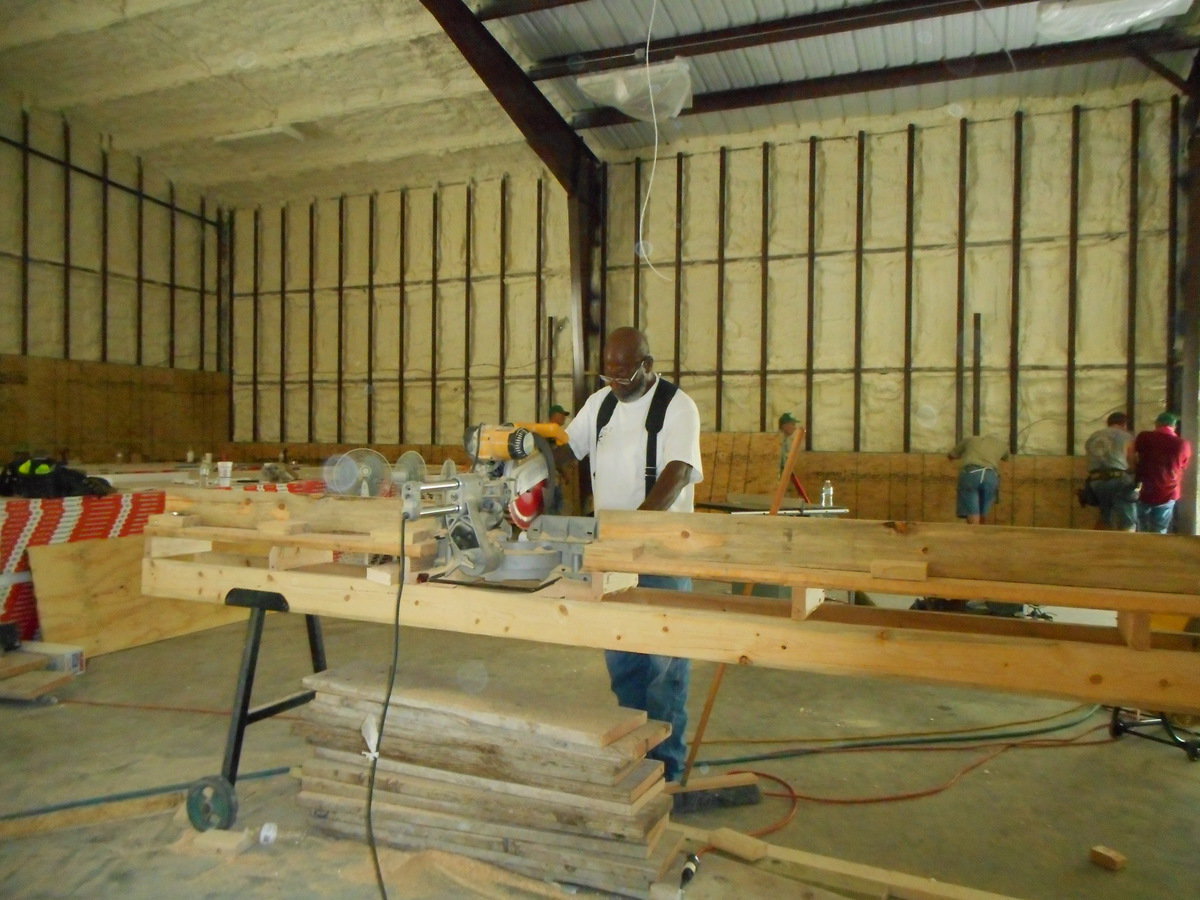 Image: Master electrician, Jessie Darrett, is helping in the Family Life Center.