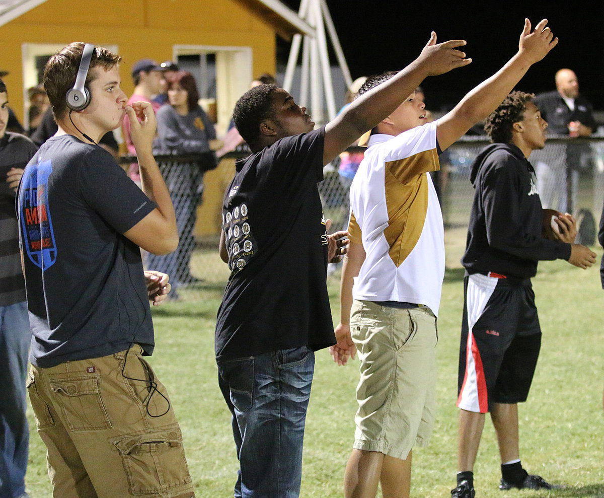 Image: Senior Girls head coach Joe Celis (second from right) and his assistant coaches James Walton, Kenneth Norwood and ball boy Keith Davis are active on that sideline.