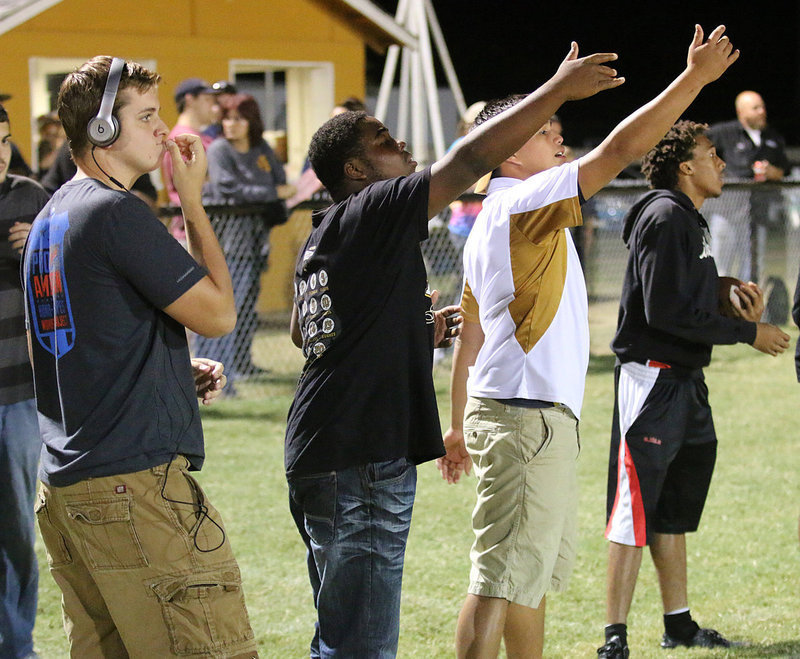 Image: Senior Girls head coach Joe Celis (second from right) and his assistant coaches James Walton, Kenneth Norwood and ball boy Keith Davis are active on that sideline.