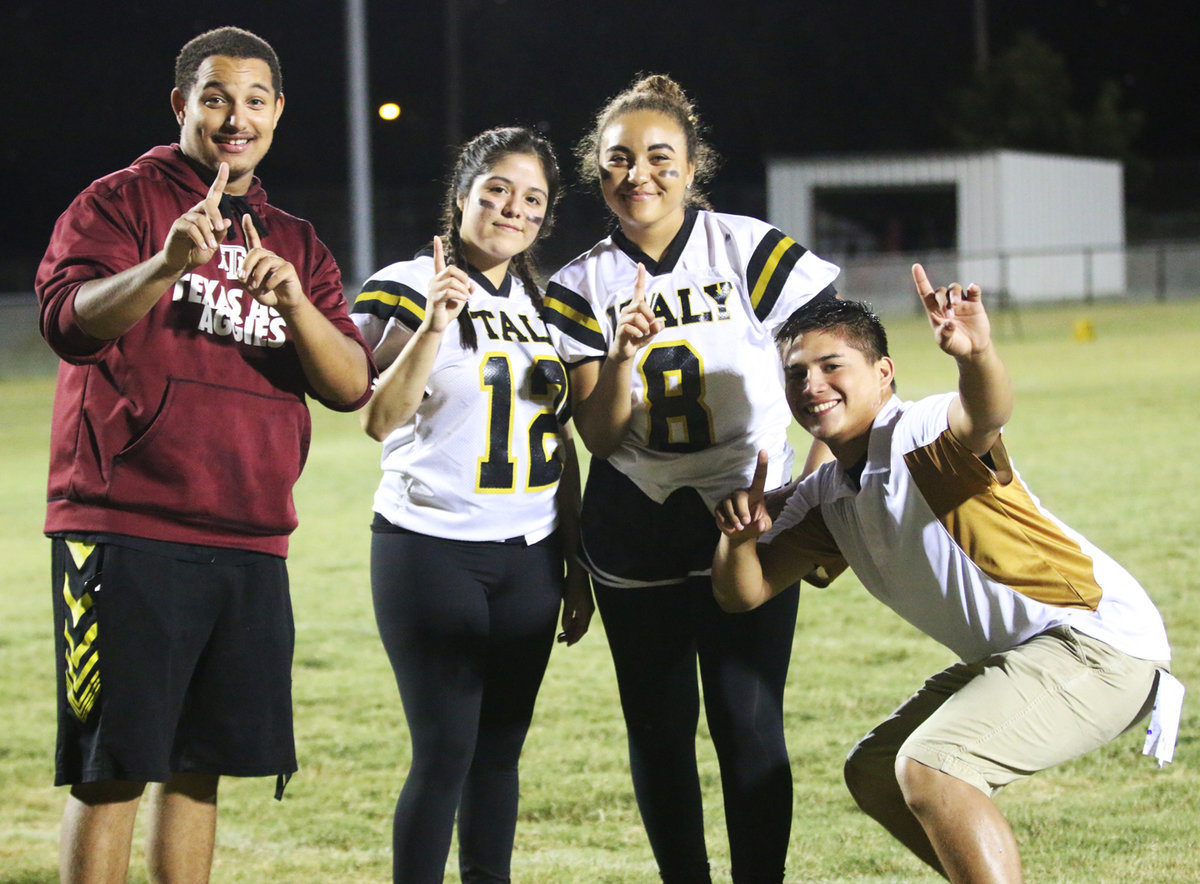 Image: Senior Girls head coach, Joe Celis, celebrates the Powder Puff victory with, Tristan Cotten, Kimberley Mata and Vanessa Cantu.
