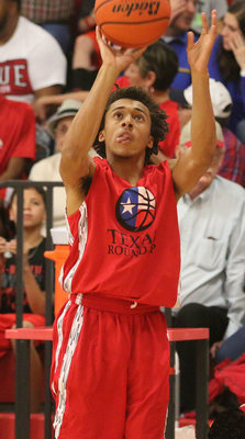 Image: Italy’s Keith Davis II attempts a 3-pointer from the corner for the RED All-Stars.