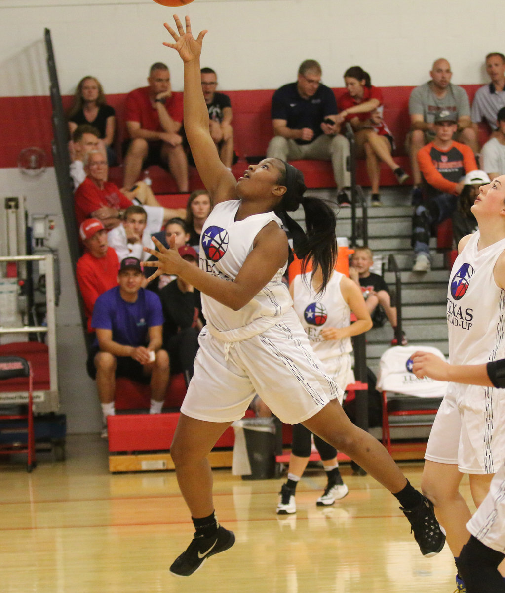 Image: Aarion Copeland, Italy, (24) finishes the drive with a layup.