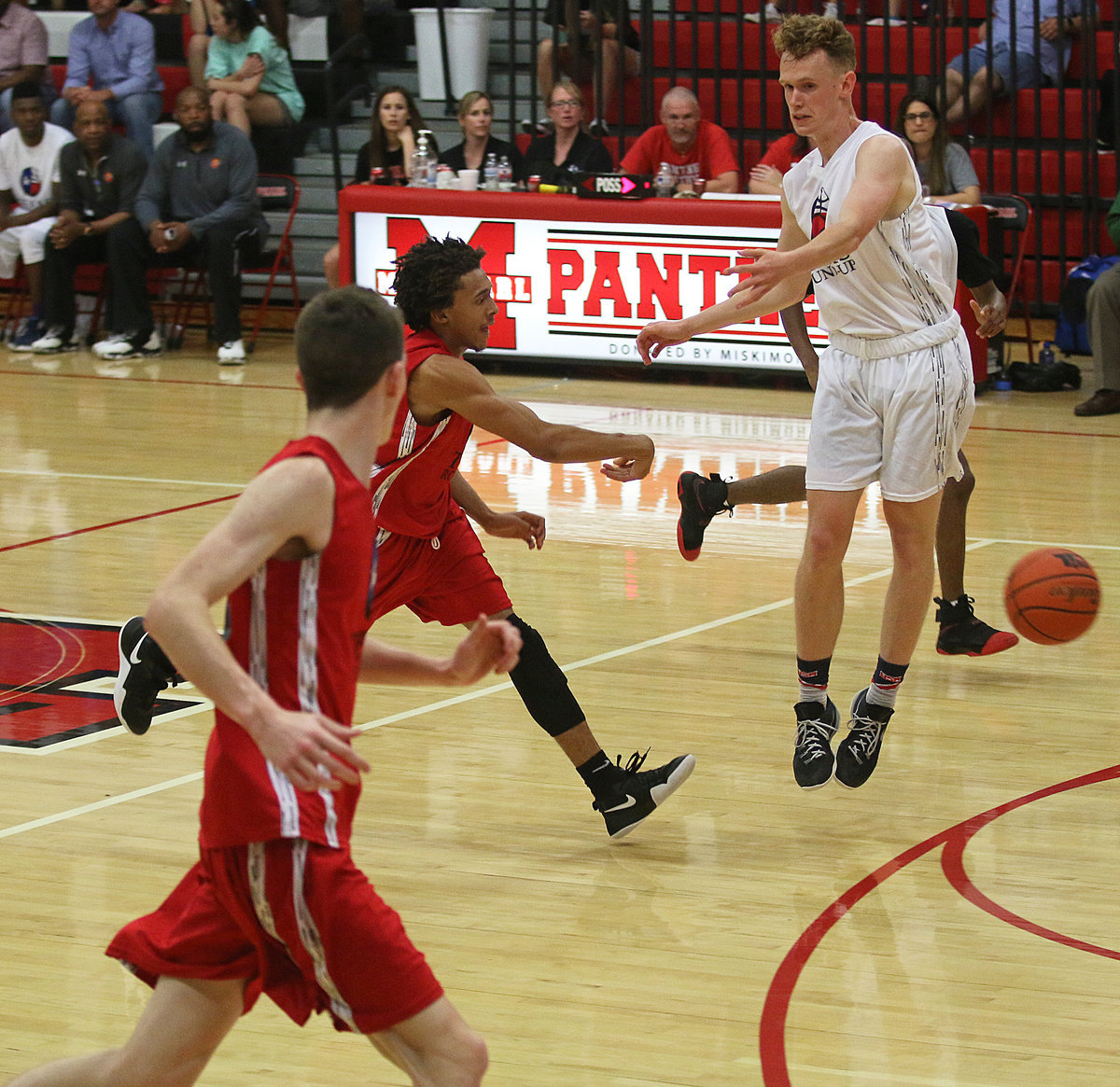 Image: Leading the fast-break is Keith Davis II, Italy, as his pass turns into 2-points for the RED All-Stars.