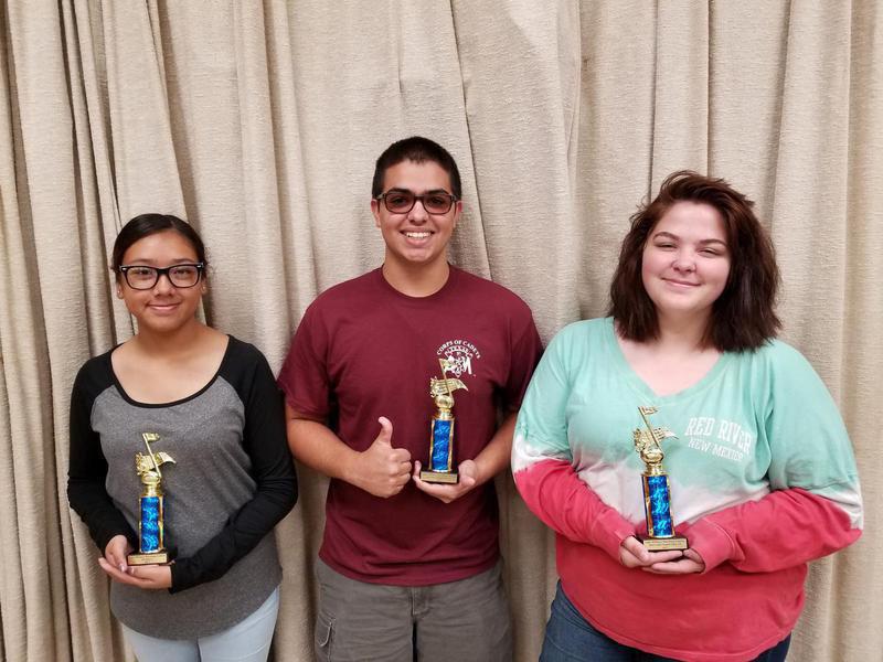 Image: Drum Majors Antonia Salazar and Isaac Garcia and Colorguard Captain Sarah Burrow.